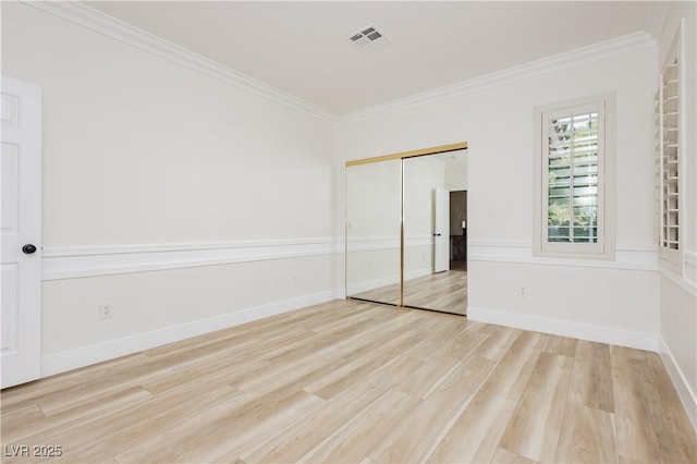 4493 Rometta Ave, Las Vegas, NV 89141 - unfurnished bedroom with crown molding, wood finished floors, and a closet
