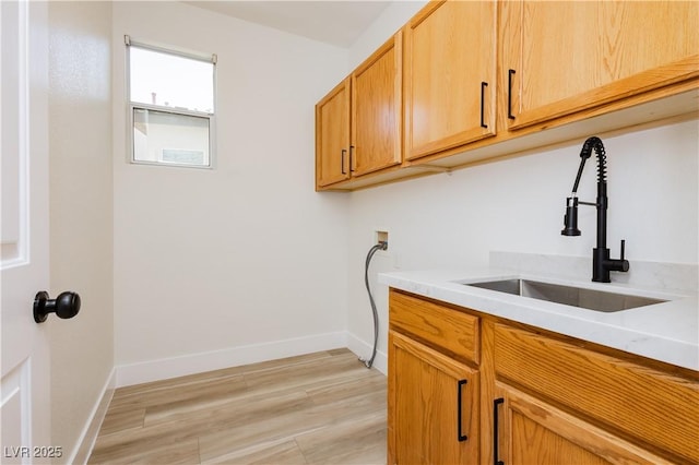 4493 Rometta Ave, Las Vegas, NV 89141 - laundry room with cabinet space, washer hookup, and light wood-type flooring