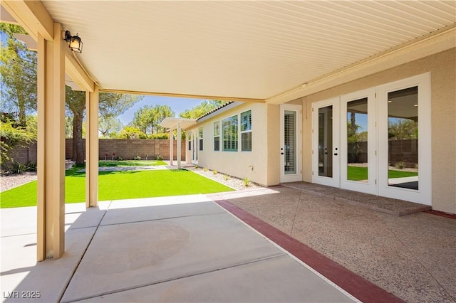 4493 Rometta Ave, Las Vegas, NV 89141 - fenced backyard featuring french doors and a patio