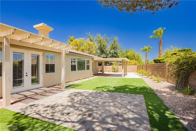 4493 Rometta Ave, Las Vegas, NV 89141 - fenced backyard with a pergola, a patio area, and french doors
