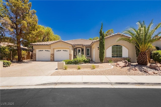 4493 Rometta Ave, Las Vegas, NV 89141 - mediterranean / spanish-style house with stone siding, a garage, stucco siding, and a tiled roof