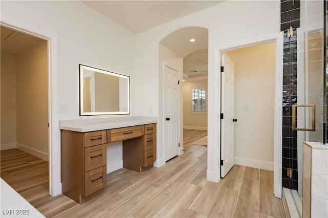 4493 Rometta Ave, Las Vegas, NV 89141 - bathroom featuring vanity, wood finished floors, a tile shower, and recessed lighting