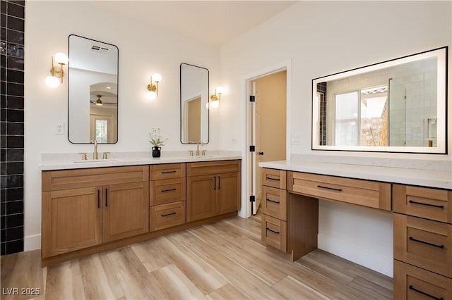 4493 Rometta Ave, Las Vegas, NV 89141 - full bath with double vanity, wood finished floors, and a tile shower