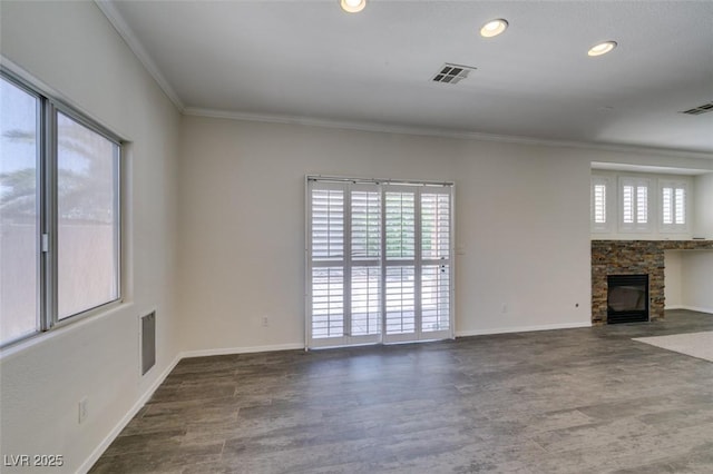 1453 Doggett Ave, Las Vegas, NV 89123 - unfurnished living room with crown molding, wood finished floors, healthy amount of natural light, a stone fireplace, and recessed lighting