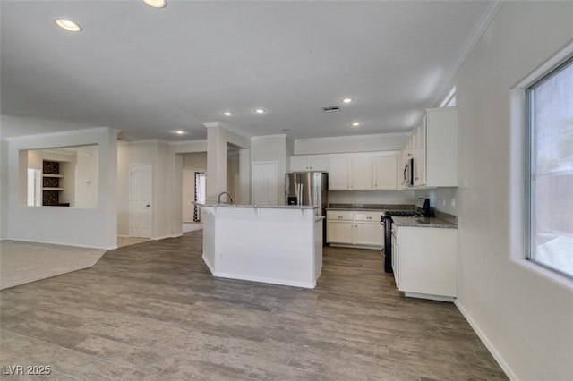 1453 Doggett Ave, Las Vegas, NV 89123 - kitchen featuring stainless steel appliances, ornamental molding, white cabinets, recessed lighting, and healthy amount of natural light