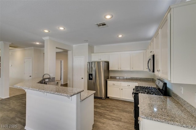 1453 Doggett Ave, Las Vegas, NV 89123 - kitchen with stainless steel appliances, ornamental molding, a breakfast bar area, light stone countertops, and recessed lighting