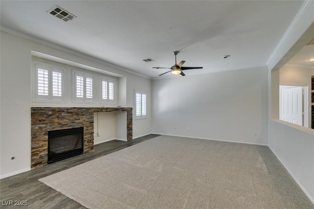 1453 Doggett Ave, Las Vegas, NV 89123 - unfurnished living room featuring crown molding, a stone fireplace, ceiling fan, and wood finished floors