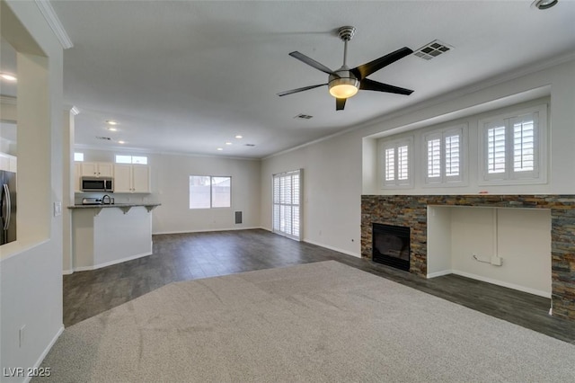1453 Doggett Ave, Las Vegas, NV 89123 - unfurnished living room featuring ornamental molding, dark wood-style floors, a fireplace, a ceiling fan, and recessed lighting