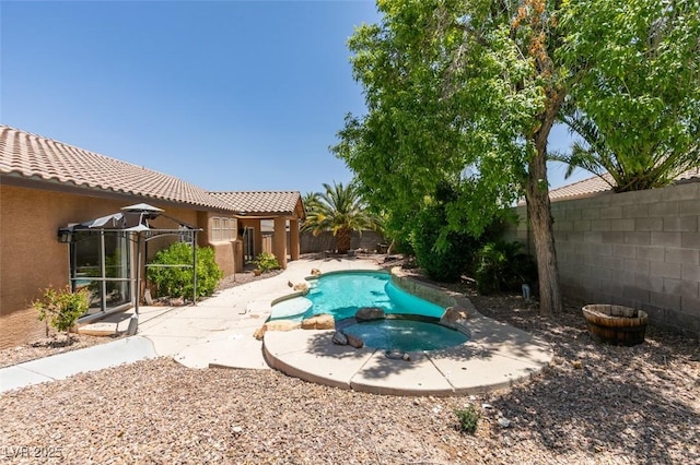 1453 Doggett Ave, Las Vegas, NV 89123 - view of swimming pool with a fenced backyard, a pool with connected hot tub, and a patio
