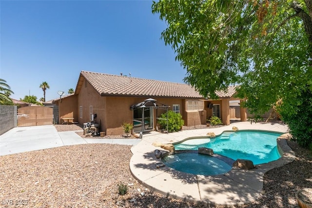 1453 Doggett Ave, Las Vegas, NV 89123 - view of pool featuring a pool with connected hot tub, a patio area, a gate, and a gazebo