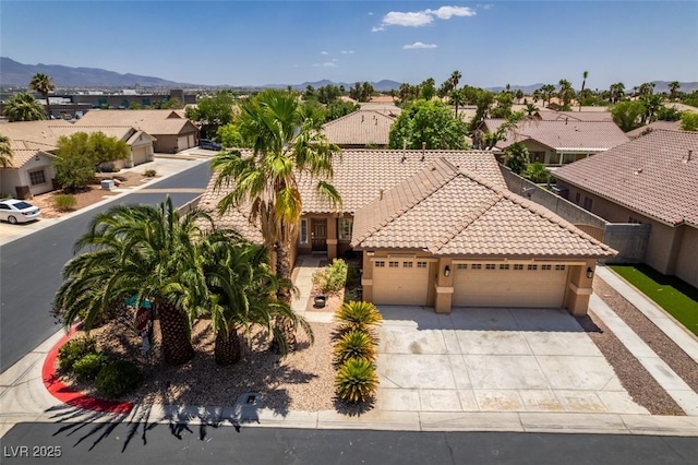1453 Doggett Ave, Las Vegas, NV 89123 - view of front of property with a tile roof, a garage, a residential view, driveway, and stucco siding