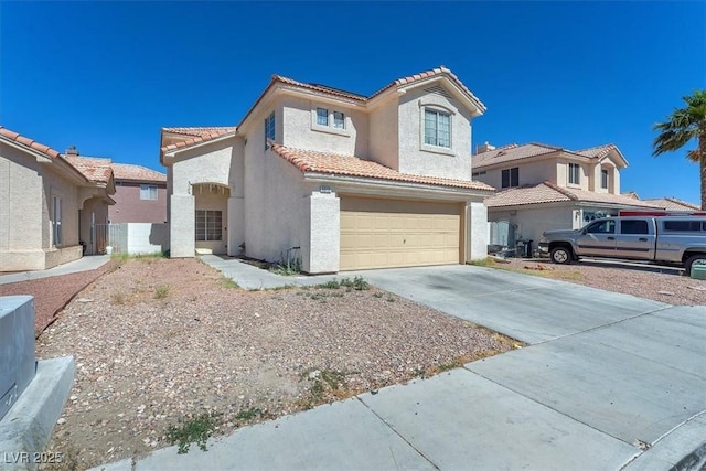 5612 Royal Castle Ln, Las Vegas, NV 89130 - view of front of property with stucco siding, a tile roof, driveway, and an attached garage