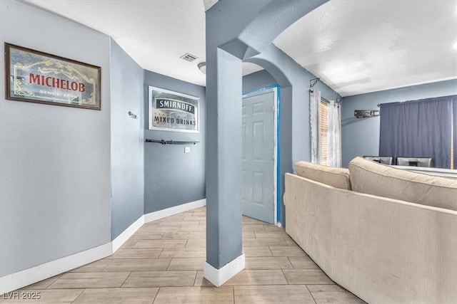 5612 Royal Castle Ln, Las Vegas, NV 89130 - hall with wood tiled floors and arched walkways