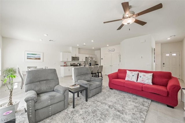7730 Moore Creek Ln, North Las Vegas, NV 89084 - living area featuring a ceiling fan, recessed lighting, and light tile patterned floors
