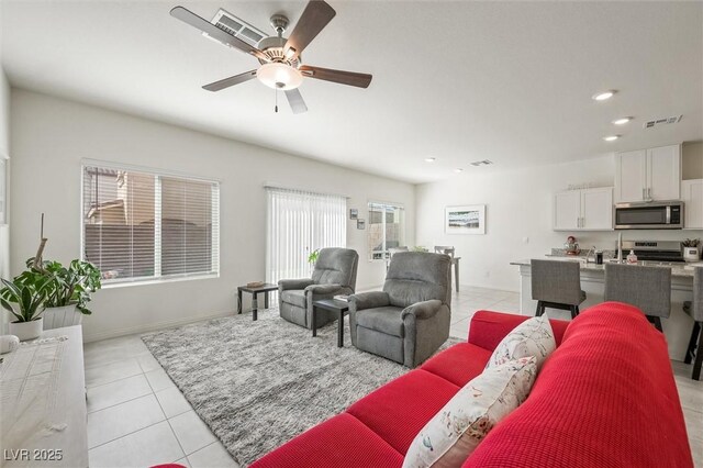 7730 Moore Creek Ln, North Las Vegas, NV 89084 - living room featuring light tile patterned floors, a ceiling fan, and recessed lighting