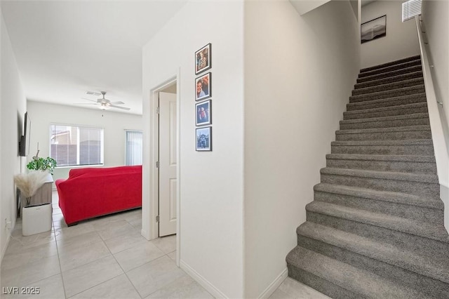 7730 Moore Creek Ln, North Las Vegas, NV 89084 - stairs featuring a ceiling fan and tile patterned flooring
