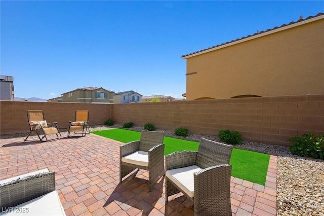 7730 Moore Creek Ln, North Las Vegas, NV 89084 - fenced backyard with a patio area