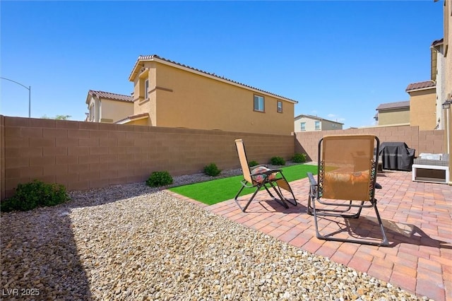 7730 Moore Creek Ln, North Las Vegas, NV 89084 - fenced backyard featuring a grill and a patio area