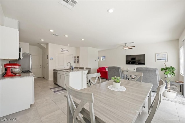 7730 Moore Creek Ln, North Las Vegas, NV 89084 - dining area with ceiling fan, light tile patterned floors, and recessed lighting