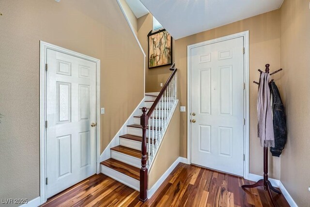 6125 Broken Slate Way, Las Vegas, NV 89139 - entrance foyer with dark wood-style floors and stairway