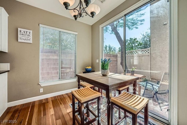 6125 Broken Slate Way, Las Vegas, NV 89139 - dining area featuring wood finished floors and a chandelier