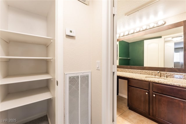 2866 Loveland Dr Unit 2018, Las Vegas, NV 89109 - bathroom featuring vanity, tile patterned floors, and a heating unit
