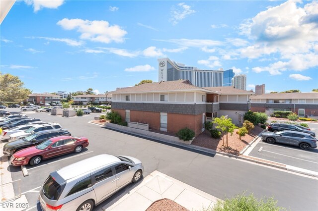 2866 Loveland Dr Unit 2018, Las Vegas, NV 89109 - uncovered parking lot featuring a residential view