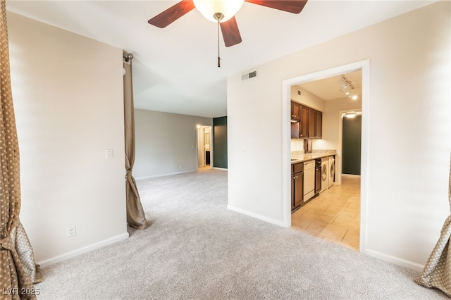 2866 Loveland Dr Unit 2018, Las Vegas, NV 89109 - unfurnished room with light colored carpet, ceiling fan, and light tile patterned floors