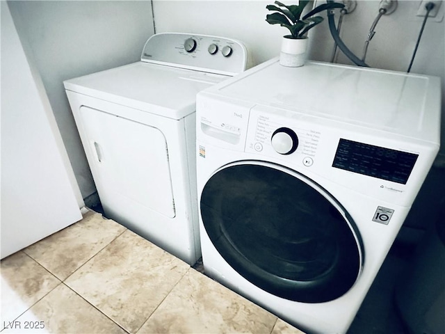 5821 Marka Dr, Las Vegas, NV 89108 - laundry room with tile patterned floors and washing machine and clothes dryer