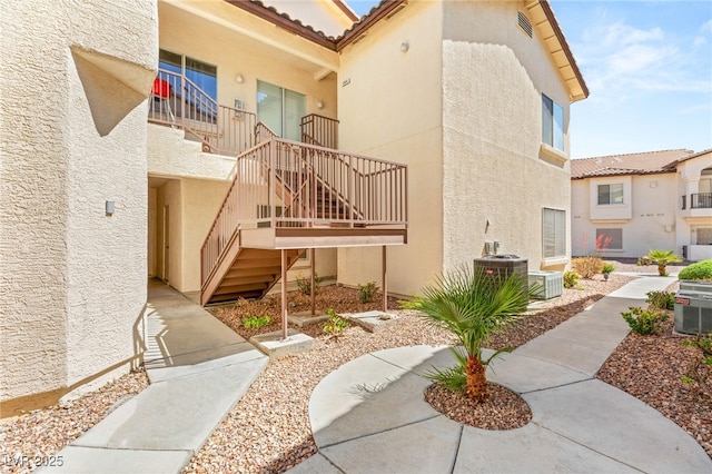 4830 Grey Wolf Ln Unit 104, Las Vegas, NV 89149 - view of exterior entry with stucco siding and a tiled roof