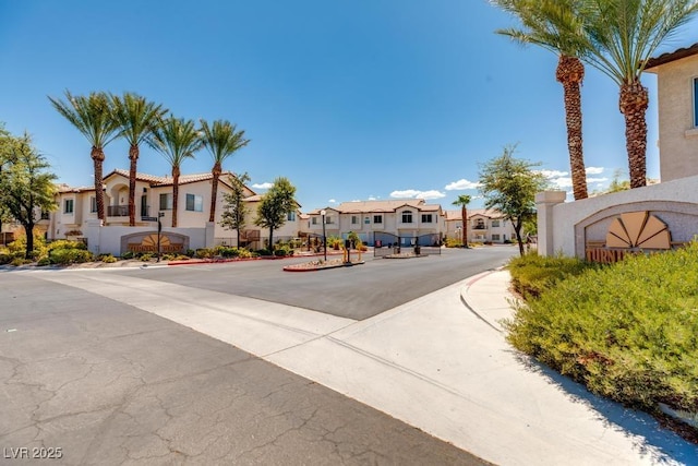 4830 Grey Wolf Ln Unit 104, Las Vegas, NV 89149 - view of asphalt street with a residential view, sidewalks, and curbs