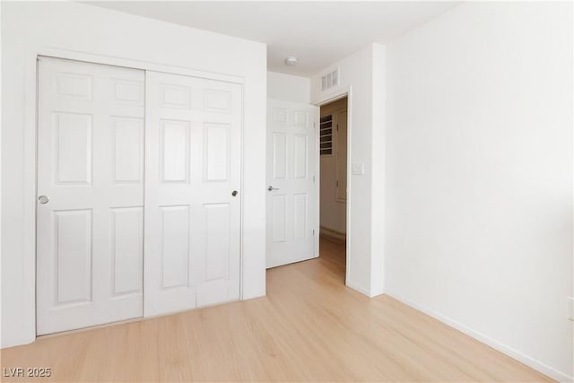 10013 Sable Point St, Las Vegas, NV 89178 - unfurnished bedroom featuring light wood-style flooring and a closet