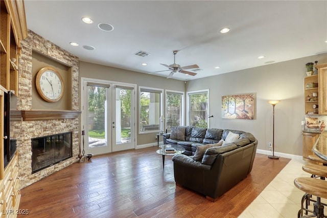 2008 Winter Wind St, Las Vegas, NV 89134 - living area with ceiling fan, a stone fireplace, recessed lighting, and wood finished floors