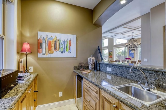 2008 Winter Wind St, Las Vegas, NV 89134 - kitchen featuring a chandelier, stone countertops, wine cooler, and light tile patterned floors
