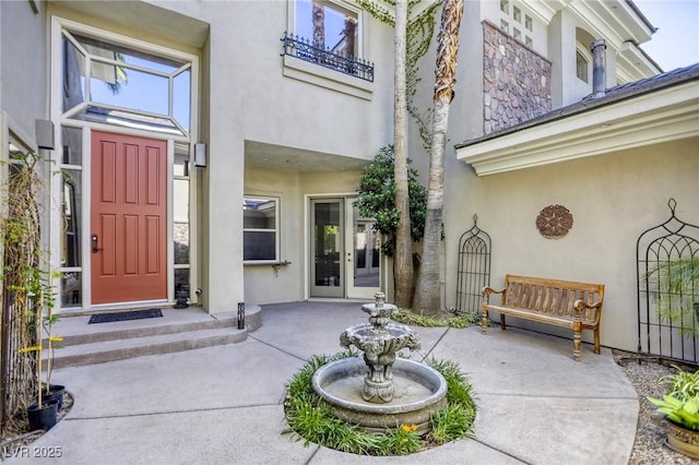 2008 Winter Wind St, Las Vegas, NV 89134 - entrance to property featuring french doors, stucco siding, and a patio