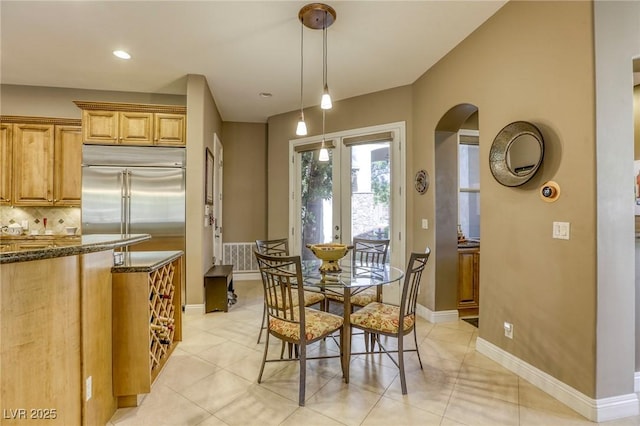 2008 Winter Wind St, Las Vegas, NV 89134 - dining space with arched walkways, light tile patterned flooring, french doors, and recessed lighting