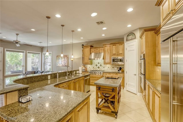 2008 Winter Wind St, Las Vegas, NV 89134 - kitchen with built in appliances, a large island with sink, under cabinet range hood, tasteful backsplash, and recessed lighting