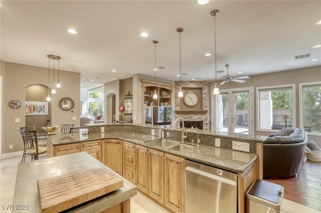 2008 Winter Wind St, Las Vegas, NV 89134 - kitchen with dishwasher, open floor plan, a center island with sink, healthy amount of natural light, and recessed lighting