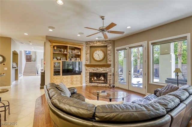 2008 Winter Wind St, Las Vegas, NV 89134 - living area featuring a ceiling fan, a fireplace, stairway, recessed lighting, and tile patterned flooring