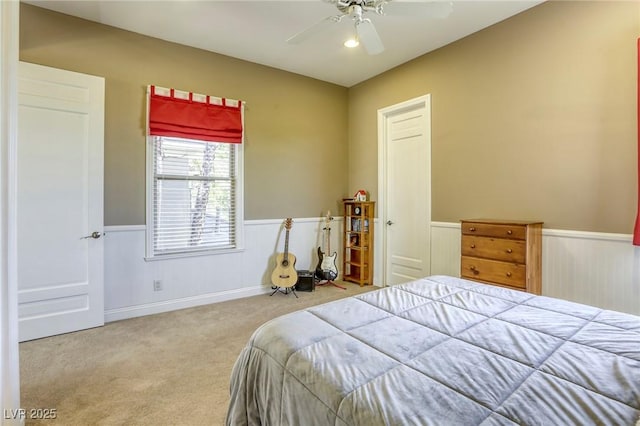 2008 Winter Wind St, Las Vegas, NV 89134 - bedroom featuring wainscoting, carpet floors, and a ceiling fan