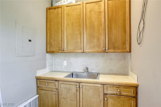 2008 Winter Wind St, Las Vegas, NV 89134 - kitchen featuring tasteful backsplash, light countertops, and electric panel