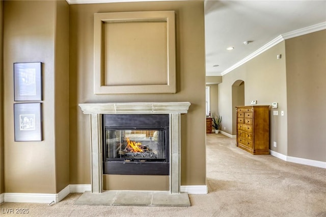 2008 Winter Wind St, Las Vegas, NV 89134 - detailed view of carpet flooring, ornamental molding, a multi sided fireplace, arched walkways, and a smoke detector