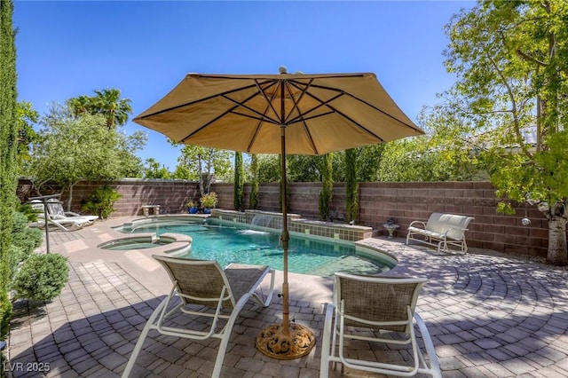 2008 Winter Wind St, Las Vegas, NV 89134 - view of swimming pool featuring a fenced backyard, a patio area, and a pool with connected hot tub