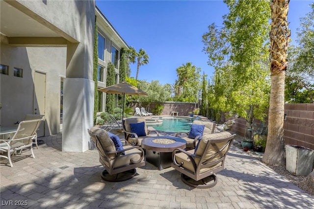 2008 Winter Wind St, Las Vegas, NV 89134 - fenced backyard with an outdoor fire pit and a patio area