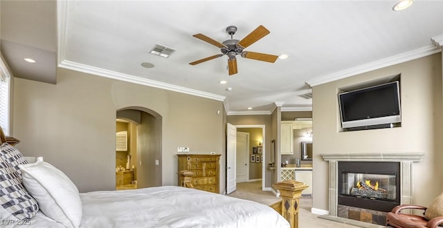 2008 Winter Wind St, Las Vegas, NV 89134 - bedroom featuring recessed lighting, ensuite bath, a multi sided fireplace, light colored carpet, and ornamental molding