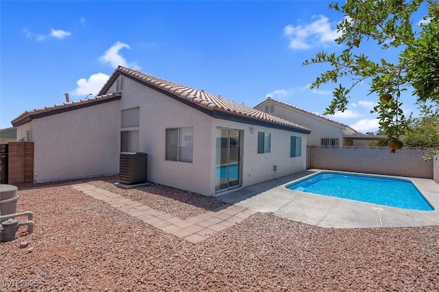 2832 Sing Song Way, Las Vegas, NV 89106 - back of house featuring a fenced backyard, a tiled roof, stucco siding, and a patio area