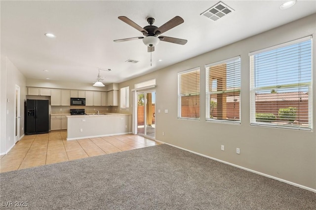 3609 Kingfishers Catch Ave, North Las Vegas, NV 89084 - unfurnished living room with recessed lighting, light tile patterned floors, a ceiling fan, and light colored carpet