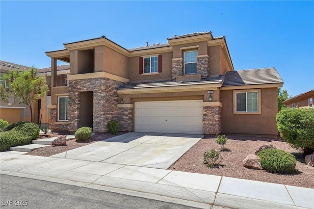 3609 Kingfishers Catch Ave, North Las Vegas, NV 89084 - view of front facade featuring stone siding, stucco siding, an attached garage, and driveway