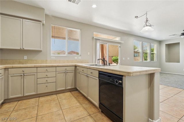 3609 Kingfishers Catch Ave, North Las Vegas, NV 89084 - kitchen with black dishwasher, light tile patterned floors, open floor plan, a peninsula, and recessed lighting
