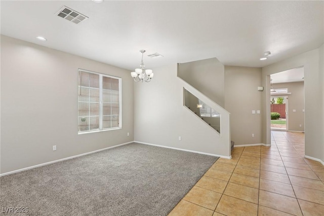 3609 Kingfishers Catch Ave, North Las Vegas, NV 89084 - spare room with a chandelier, light tile patterned floors, light carpet, and stairs